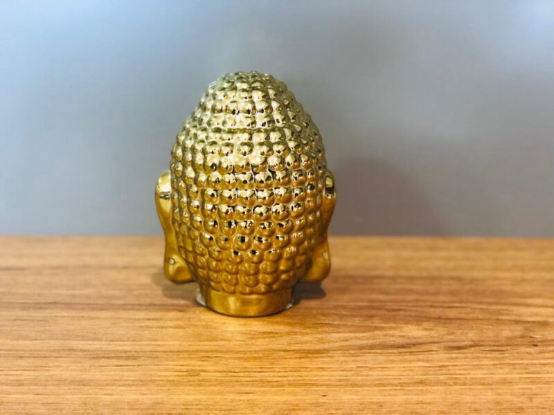 Escultura cabeça Buda na cor dourada